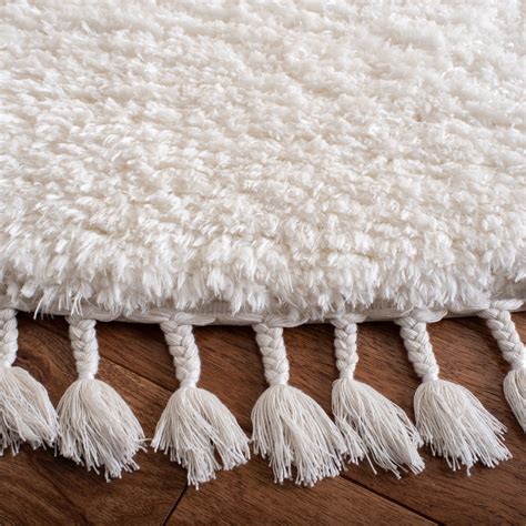 white tassel rug